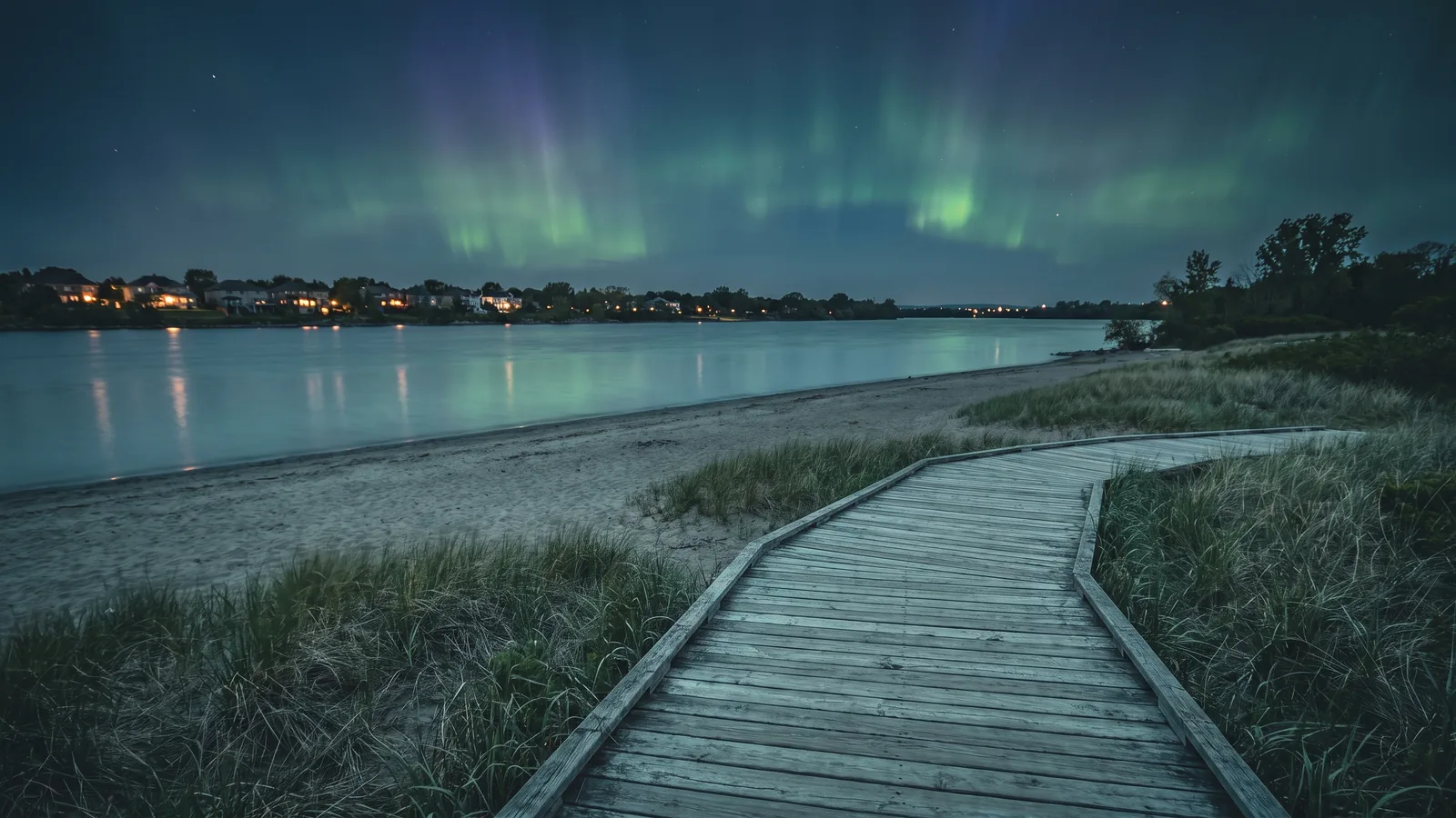 Petrie Island beach and boardwalk in Orléans at dusk under the northern lights